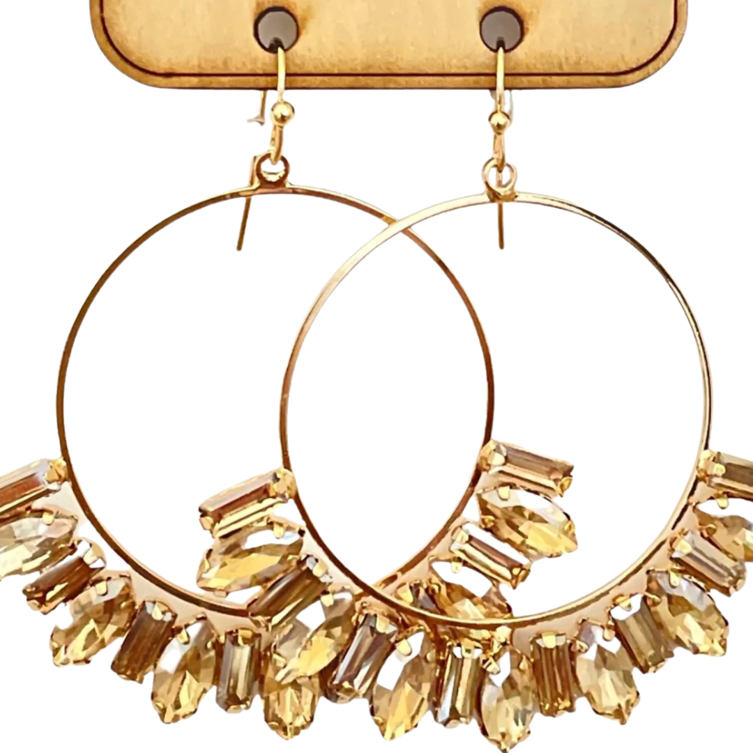 Hooped Baguette Earrings that truly sparkle and steal the show! Instant eye catchers that will instantly become your go to earrings. Lightweight and easy to wear all day!  Features:  Circle earrings with baguette rhinestones Gold/Champagne or Clear/Silver