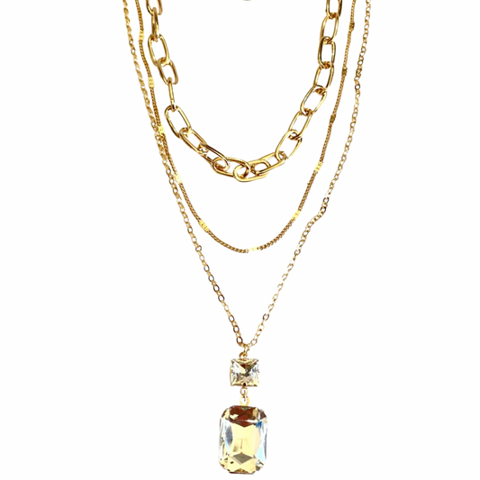 The Barracuda Necklace features 3 layers of gold chains. The longest layer features a clear square and rectangle rhinestone pendants that really shines like the star in this show.